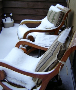 Snow covered deck chairs